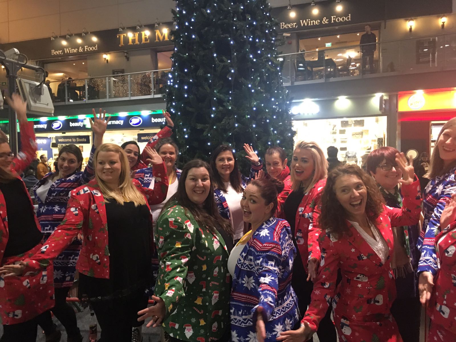 Flash choir mob brings touch of festive cheer to commuters at Manchester Piccadilly