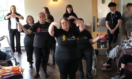 Singing and dancing gives residents a Divine Day