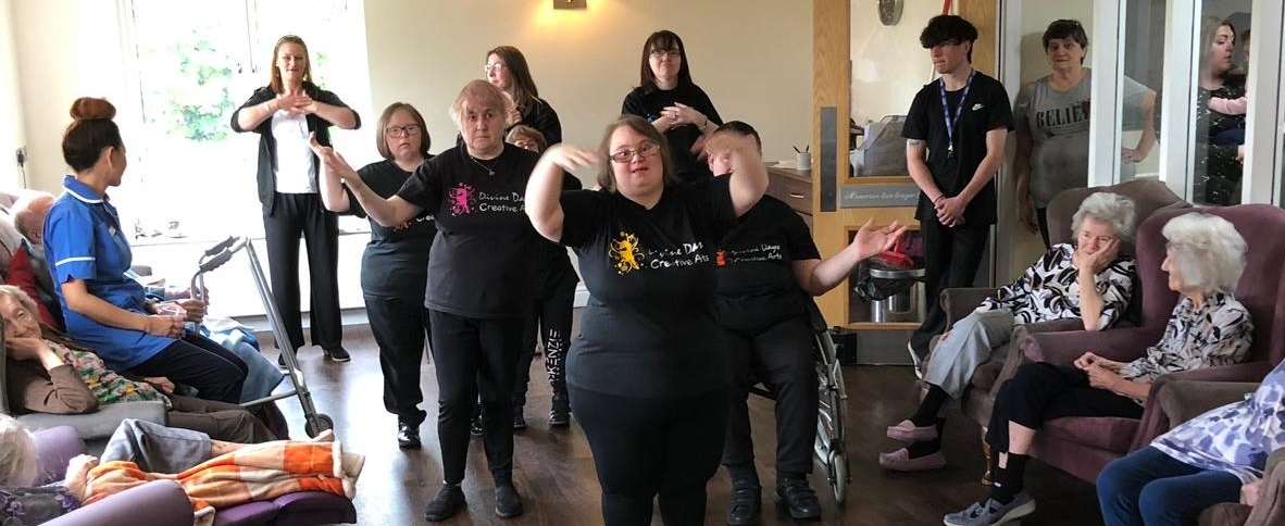 Singing and dancing gives residents a Divine Day
