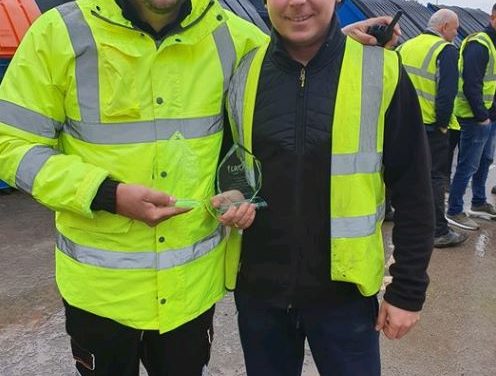 Employees at UK Container Maintenance celebrate ten years’ service