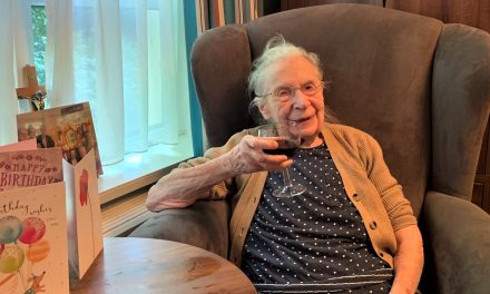 Winifred raises a glass of red to her 102nd birthday