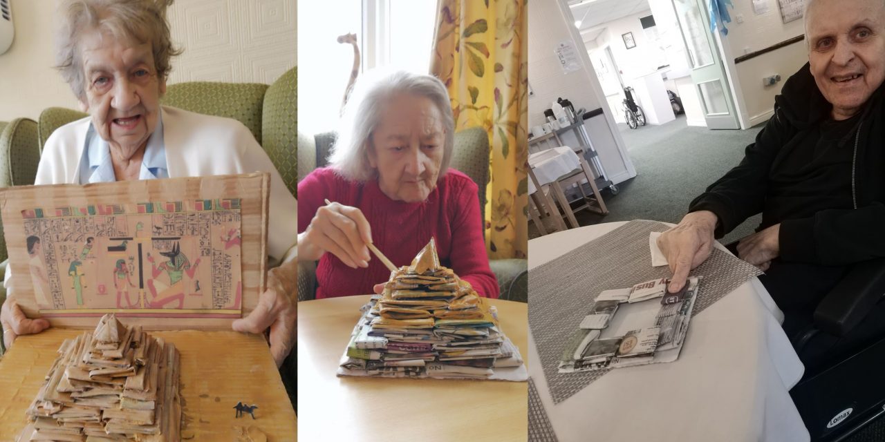 Residents build paper pyramid for archaeology competition