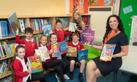 Bellway boosts school library with book donation