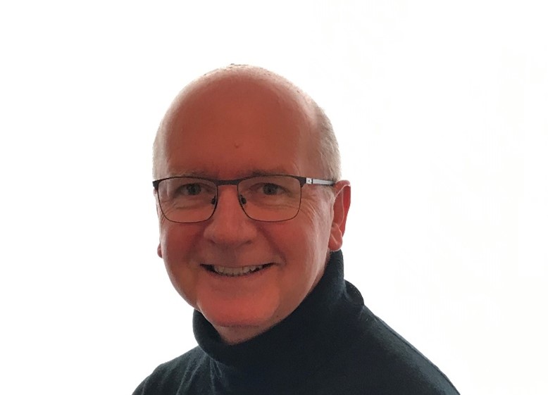 Retiree returns to his native Liverpool and provides tutoring support and inspiration for Merseyside young people