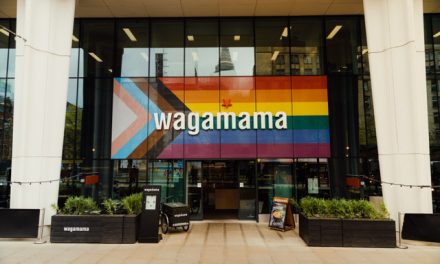 wagamama updates its giant pride flag to the progressive pride flag at Manchester St Peters Square restaurant.