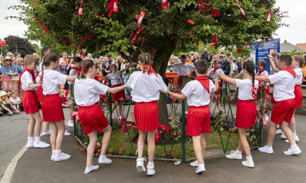 Cheshire housebuilders make donation to traditional ‘Bawming the Thorn’ event in Appleton Thorn