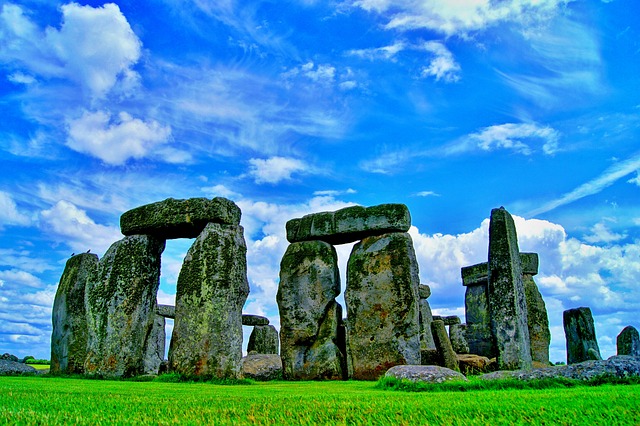Stonehenge, located in Wiltshire, England, is one of the world’s most iconic and enigmatic prehistoric monuments. A masterpiece of ancient engineering and construction, this UNESCO World Heritage Site has intrigued historians, archaeologists, and visitors for centuries. While its exact purpose remains uncertain, Stonehenge continues to captivate with its grandeur and mystery.  The Origins and Construction of Stonehenge  Stonehenge was built in several phases over a period spanning from approximately 3000 BCE to 2000 BCE, during the Neolithic and early Bronze Age. The monument consists of a circular arrangement of massive standing stones, with some weighing up to 25 tons and towering over 13 feet high.  The site contains two main types of stones:  Sarsen stones: Large sandstone blocks, which were transported from Marlborough Downs, about 20 miles away.  Bluestones: Smaller stones that originated from the Preseli Hills in Wales, over 150 miles away. The transportation of these stones remains one of the greatest mysteries surrounding Stonehenge.  The monument’s construction required remarkable ingenuity, as the builders had no advanced tools or machinery. Experts believe that logs, ropes, and sheer manpower were used to transport and erect the massive stones.  Purpose and Theories  The exact reason for the construction of Stonehenge remains a subject of debate, but several theories have emerged over the years:  Astronomical Calendar: Many researchers believe that Stonehenge was designed as a celestial observatory. The alignment of the stones with the summer and winter solstices suggests that the site may have been used to track the movement of the sun and stars.  Religious or Ceremonial Site: Some theories suggest that Stonehenge served as a place of worship or a site for sacred rituals, possibly dedicated to the dead or deities of nature.  Burial Ground: Excavations have revealed numerous human remains near the site, leading some archaeologists to believe that Stonehenge functioned as a burial ground for elite members of society.  Stonehenge in Modern Times  Today, Stonehenge is a major tourist attraction, drawing millions of visitors from around the world. The site is especially popular during the summer and winter solstices, when people gather to witness the sun align perfectly with the stones—just as it may have done for ancient civilizations.  The mystery of Stonehenge continues to inspire researchers and visitors alike. Whether it was a sacred temple, a prehistoric calendar, or a monument to the dead, Stonehenge stands as a testament to the ingenuity and spirituality of early human societies.  Would you like to experience this historical wonder for yourself? Stonehenge is open year-round, with guided tours, exhibitions, and an immersive visitor center that brings its ancient story to life.: A Mysterious Marvel of the Ancient World